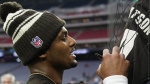 Cleveland Browns quarterback Deshaun Watson signs autographs before of an NFL football game between the Cleveland Browns and Houston Texans in Houston, Sunday, Dec. 4, 2022,. (AP Photo/Eric Gay)
