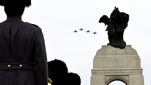 CF-18 Hornets perform a flypast at the National War Memorial during the National Remembrance Day Ceremony in Ottawa, on Friday, Nov. 11, 2022. THE CANADIAN PRESS/Justin Tang