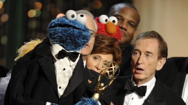 Bob McGrath, right, looks at the Cookie Monster as they accept the Lifetime Achievement Award for '"Sesame Street" at the Daytime Emmy Awards on Aug. 30, 2009, in Los Angeles. McGrath, an actor, musician and children’s author widely known for his portrayal of one of the first regular characters on the children’s show “Sesame Street” has died at the age of 90. McGrath’s passing was confirmed by his family who posted on his Facebook page on Sunday, Dec. 4, 2022. (AP Photo/Chris Pizzello, File)