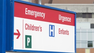 A sign directing visitors to the emergency department is shown at CHEO, in Ottawa, Friday, May 15, 2015. Several major Ontario pediatric hospitals say they are not asking for external staff support, as Ottawa's CHEO prepares to bring in Red Cross staff until at least the end of the year. THE CANADIAN PRESS/Adrian Wyld