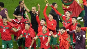 Morocco players celebrate at the end of the World Cup round of 16 soccer match between Morocco and Spain, at the Education City Stadium in Al Rayyan, Qatar, Tuesday, Dec. 6, 2022. (AP Photo/Ricardo Mazalan)