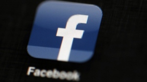FILE - The Facebook logo is displayed on an iPad in Philadelphia, May 16, 2012. Facebook parent Meta Platforms Inc. said Tuesday, Dec. 6, 2022, it will be “forced to consider” removing news content from its platform if Congress passes legislation requiring tech companies to pay news outlets for their material. (AP Photo/Matt Rourke, File)