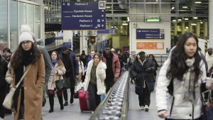 Passengers arrive at the Euston railway station