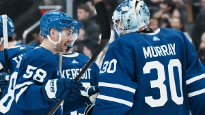 Toronto Maple Leafs' Michael Bunting celebrates with goaltender Matt Murray (30) after defeating the Tampa Bay Lightning in NHL hockey action in Toronto, on Tuesday, December 20, 2022.THE CANADIAN PRESS/Chris Young