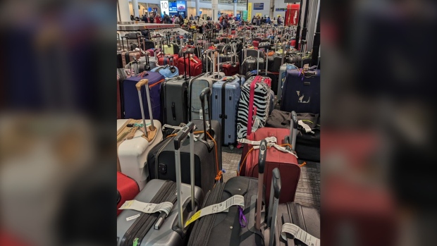 Piles of luggage sit waiting for pickup at Toronto Pearson International Airport Monday, December 26, 2022.(Jonathan Carvalho /CP24)