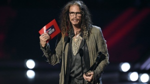 FILE - Steven Tyler presents the award for song of the year at the iHeartRadio Music Awards on Thursday, March 14, 2019, at the Microsoft Theater in Los Angeles. A woman who has previously said Tyler had an illicit sexual relationship with her when she was a teenager is now suing the Aerosmith frontman for sexual assault, sexual battery and intentional infliction of emotional distress. (Photo by Chris Pizzello/Invision/AP, File)