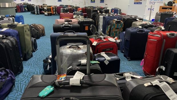 Unclaimed checked bags are shown at the Vancouver International Airport on Tuesday Jan. 3, 2023. About 1,500 checked bags remain unclaimed at Vancouver International Airport after winter storms wrecked havoc on holiday travel last month. THE CANADIAN PRESS/Brenna Owen