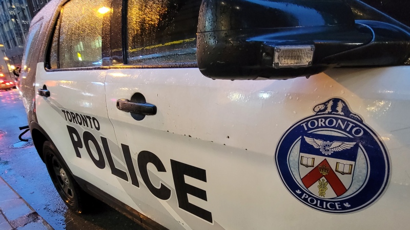 A Toronto police vehicle is shown parked on Yonge Street as rain falls in downtown Toronto on Tuesday Jan. 3, 2023. THE CANADIAN PRESS/Doug Ives