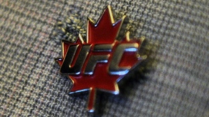 A pin with the Ultimate Fighting Championship logo and a maple leaf is shown in Ottawa on Thursday, September 29, 2011. THE CANADIAN PRESS/Sean Kilpatrick