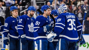 Toronto Maple Leafs centre John Tavares (91) celebrates with goaltender Ilya Samsonov (35) and teammates after defeating the Detroit Red Wings 4-1 in NHL hockey action in Toronto, on Saturday, January 7, 2023. THE CANADIAN PRESS/Christopher Katsarov