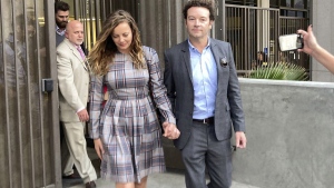 FILE - Actor Danny Masterson leaves Los Angeles superior Court with his wife Bijou Phillips after a judge declared a mistrial in his rape case in Los Angeles on Nov. 30, 2022. Los Angeles prosecutors will retry “That ’70s Show” actor Danny Masterson on three rape counts after a hopelessly deadlocked jury led to a mistrial in his first trial in November. (AP Photo/Brian Melley, File)