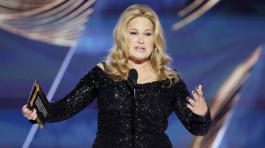 This image released by NBC shows Jennifer Coolidge accepting the Best Actress in a Limited or Anthology Series or Television Film award for "The White Lotus" during the 80th Annual Golden Globe Awards at the Beverly Hilton Hotel on Tuesday, Jan. 10, 2023, in Beverly Hills, Calif. (Rich Polk/NBC via AP)