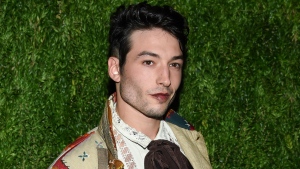 FILE - Ezra Miller attends the 15th annual CFDA/Vogue Fashion Fund event at the Brooklyn Navy Yard in New York on Nov. 5, 2018. Miller, known for playing "The Flash" in "Justice League" films, has reached a plea agreement with Vermont prosecutors in which they will plead guilty to an unlawful trespass charge that they broke into a home and stole three bottles of liquor. (Photo by Evan Agostini/Invision/AP, File)