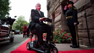 Outgoing Ontario Lieutenant-Governor David Onley is saluted while arriving for his last full day in office at Queen's Park in Toronto on Monday, September 22, 2014. THE CANADIAN PRESS/Darren Calabrese