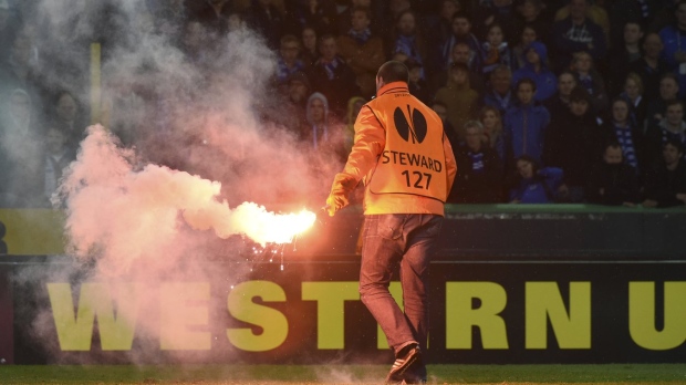 a flare at Jan Breydel stadium in Bruges, Belgium