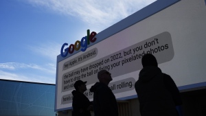 Workers help set up the Google booth at the Las Vegas Convention Center before the start of the CES tech show, Monday, Jan. 2, 2023, in Las Vegas. (AP Photo/John Locher)