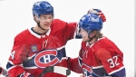 Montreal Canadiens Rem Pitlick (32) celebrates with teammate Jordan Harris after scoring against the Toronto Maple Leafs during overtime period NHL hockey action in Montreal, Saturday, January 21, 2023. THE CANADIAN PRESS/Graham Hughes