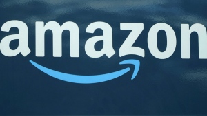 FILE - An Amazon logo appears on a delivery van, Oct. 1, 2020, in Boston. Amazon is adding a prescription drug discount program to its growing health care business. The retail giant said Tuesday that it will launch RxPass, a subscription service for customers who have Prime memberships. (AP Photo/Steven Senne, File)