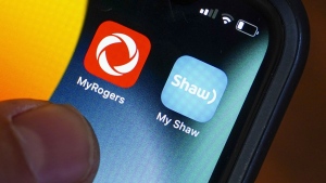 The House of Commons industry and technology committee is set to hold a meeting today looking at Rogers Communications Inc.'s proposed takeover of Shaw Communications Inc. Rogers and Shaw applications are pictured on a cellphone in Ottawa on Monday, May 9, 2022. THE CANADIAN PRESS/Sean Kilpatrick