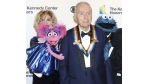 Honoree Lloyd Morrisett appears with muppet characters at the 42nd Annual Kennedy Center Honors at The Kennedy Center, Sunday, Dec. 8, 2019, in Washington. Morrisett, the co-creator of the beloved children's education TV series “Sesame Street,” which uses empathy and fuzzy monsters like Abby Cadabby, Elmo and Cookie Monster to charm and teach generations around the world, has died. He was 93. Morrisett’s death was announced Tuesday by Sesame Workshop, the nonprofit he helped establish under the name the Children’s Television Workshop. (Photo by Greg Allen/Invision/AP, File)