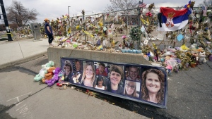 Tributes cover the temporary fence around the King Soopers grocery store in which 10 people died in a mass shooting in late March on Friday, April 23, 2021, in Boulder, Colo. A judge is scheduled to hold a hearing Friday, Jan. 27, 2023 to discuss whether a man charged with killing 10 people at a Colorado supermarket nearly two years ago is mentally competent to stand trial. (AP Photo/David Zalubowski, File)