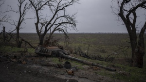 The turret of a destroyed tank is pictured outside Kalynivske, Ukraine, Saturday, Jan. 28, 2023. (AP Photo/Daniel Cole)