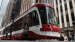FILE - A streetcar in downtown Toronto on Wednesday, July 10, 2019. THE CANADIAN PRESS/Graeme Roy 