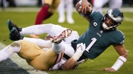 Philadelphia Eagles quarterback Jalen Hurts is sacked by San Francisco 49ers defensive end Nick Bosa during the first half of the NFC Championship NFL football game between the Philadelphia Eagles and the San Francisco 49ers on Sunday, Jan. 29, 2023, in Philadelphia. (AP Photo/Seth Wenig)