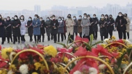 FILE - North Koreans visit and pay respect to the statues of late leaders Kim Il Sung and Kim Jong Il on Mansu Hill in Pyongyang, North Korea, on, Jan. 22, 2023, on the occasion of the Lunar New Year. Russia’s embassy in North Korea says the country has eased stringent epidemic controls in capital Pyongyang that were placed during the past five days to slow the spread of respiratory illnesses. (AP Photo/Cha Song Ho, File)