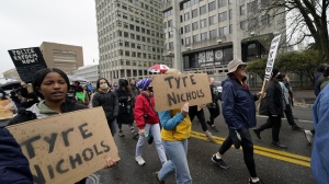Protesters march in front of police headquarters on Saturday, Jan. 28, 2023, in Memphis, Tenn., over the death of Tyre Nichols, who died after being beaten by five Memphis police officers. THE CANADIAN PRESS/AP/Gerald Herbert