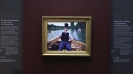 The painting "A Boating Party" by French painter Gustave Caillebotte is displayed at the Orsay Museum, Monday, Jan. 30, 2023 in Paris. France has acquired the stunning impressionist masterpiece for its national collection of art treasures, using a donation from French luxury goods giant LVMH to pay the 43-million euro ($47 million) price tag for Gustave Caillebotte's "A Boating Party." The work, remarkable in its realism, delicate coloring and almost cinematic perspective, as though the artist was in the boat with the rower, went on display in the Musée d'Orsay in Paris. (AP Photo/Aurelien Morissard)