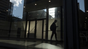 Indeed says Ontario job seekers are increasingly looking for work in other provinces, especially those looking for work in tech, engineering and natural resources. A man walks though a downtown Toronto office building with other buildings reflected in a window in this June 11, 2019 photo. THE CANADIAN PRESS/Graeme Roy