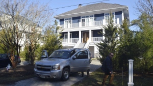 U.S. Secret Service agents are seen in front of Joe Biden's Rehoboth Beach, Del., home on Jan. 12, 2021. The FBI is conducting a planned search of President Joe Biden’s Rehoboth Beach, Delaware home as part of its investigation into the potential mishandling of classified documents. That's according to a statement from Biden's personal lawyer. (Shannon McNaught/Delaware News Journal via AP, File)