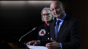 Minister of Justice and Attorney General of Canada David Lametti and Carolyn Bennett, Minister of Mental Health and Addictions and Associate Minister of Health, hold a press conference on Parliament Hill in Ottawa, Thursday, Dec. 15, 2022. THE CANADIAN PRESS/Sean Kilpatrick