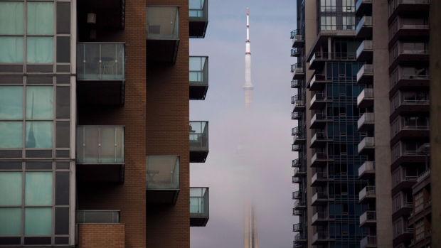 The CN Tower can be seen behind condo's in Toronto's Liberty Village community in Toronto, Ontario on Tuesday, April 25, 2017. THE CANADIAN PRESS/Cole Burston 