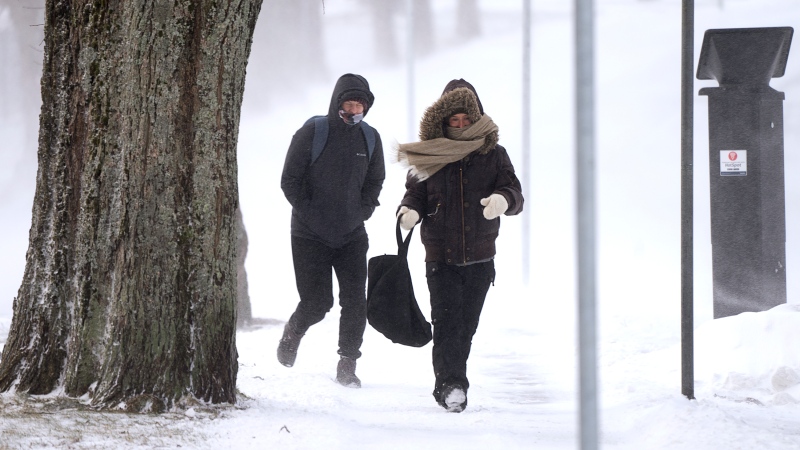 The three Maritime provinces are bracing for dangerously cold temperatures on Friday and into the weekend as an arctic air mass makes its way to the region. In this file photo, pedestrians battle the elements in Halifax on Saturday, Jan. 15, 2022. THE CANADIAN PRESS/Andrew Vaughan