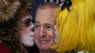 Actor Bob Odenkirk is kissed during a a news conference after being honored as Man of the Year by Harvard University's Hasty Pudding Theatricals, Thursday, Feb. 2, 2023, in Cambridge, Mass. (AP Photo/Charles Krupa)