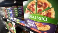 Delissio frozen pizzas are shown in the frozen food aisle at a grocery store in Toronto on Thursday, Feb. 2, 2023. Nestle Canada says it is winding down its frozen meals and pizza business in Canada over the next six months. The four brands that will no longer be sold in the freezer aisle at Canadian grocery stores are Delissio, Stouffer's, Lean Cuisine and Life Cuisine. THE CANADIAN PRESS/Joe O'Connal