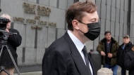 Elon Musk leaves a federal courthouse in San Francisco, Friday, Feb. 3, 2023. (AP Photo/Jeff Chiu)