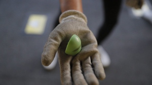 A protester holds up a fragmented piece of a Sponge round used to cause blunt trauma after a protest in Hong Kong on Sunday, Sept. 22, 2019. The federal government says it wants the RCMP to ban the use of two crowd-control tools that forces across the country say they have in their arsenals: sponge rounds and CS gas. THE CANADIAN PRESS/AP-Kin Cheung