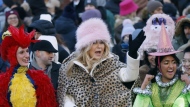 Harvard's Hasty Pudding Theatricals Woman of the Year Jennifer Coolidge, center, rides in a parade in her honor, Saturday, Feb. 4, 2023, in Cambridge, Mass. (AP Photo/Michael Dwyer)