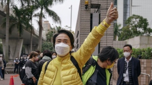 Pro-democracy activist Emily Lau Wai-hing gestures as she arrives at the West Kowloon Magistrates' Courts in Hong Kong, Monday, Feb. 6, 2023. Some of Hong Kong's best-known pro-democracy activists went on trial Monday in the biggest prosecution yet under a law imposed by China's ruling Communist Party to crush dissent. (AP Photo/Anthony Kwan)