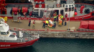 Three people are being taken to hospital after falling through the ice on Lake Ontario Monday morning.