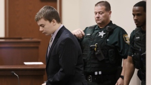 Aiden Fucci enters the courtroom Monday, Feb. 6, 2023, in the Saint Johns County Courtroom of Judge R. Lee Smith, St. Augustine, Fla. The Florida teenager has pleaded guilty to fatally stabbing a 13-year-old classmate 114 times in 2021. Fucci entered the plea just before jury selection was scheduled to begin in his first-degree murder trial. Fucci was 14 at the time of the slaying. (Bob Self/The Florida Times-Union via AP)