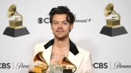 Harry Styles, winner of the award for album of the year for "Harry's House" and best pop vocal album for "Harry's House," poses in the press room at the 65th annual Grammy Awards on Sunday, Feb. 5, 2023, in Los Angeles. (AP Photo/Jae C. Hong)