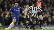 Chelsea's Pedro, left, and Newcastle United's Christian Atsu vie for the ball during the English Premier League soccer match between Chelsea and Newcastle United at Stamford Bridge stadium in London, on, Jan. 12, 2019. Former Chelsea and Newcastle forward Christian Atsu is missing and believed to be trapped under rubble following the powerful earthquake that struck Turkiye on Monday and left more than 2,500 people dead. The Ghana international plays for Turkish club Hatayspor and a club spokesman says he is thought to be in a building that was destroyed. (AP Photo/Matt Dunham, File)