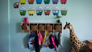 Children's backpacks and shoes are seen at a CEFA Early Learning daycare franchise, in Langley, B.C., on May 29, 2018. Now that thousands of families across Ontario are paying reduced child-care fees under the national $10-a-day program work is underway to ensure equal and greater access to affordable care, with those in the sector pointing to workforce retention and home daycare as key to the expansion. THE CANADIAN PRESS/Darryl Dyck