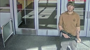 In this image taken from security camera footage provided by the Omaha, Neb., Police Department, a man identified by police as Joseph Jones, armed with an AR-15-style rifle, is seen at a Target store in Omaha on Jan. 31, 2023, before police fatally shot him. Jones, who entered the Omaha Target with an AR-15-style rifle and began firing before he was killed by police had been repeatedly sent to psychiatric hospitals because of his schizophrenia. But because Jones was never formally committed, he was able to keep purchasing guns legally, underscoring how little so-called red-flag laws do to keep firearms away from deeply troubled people. (Omaha Police Department via AP, File)