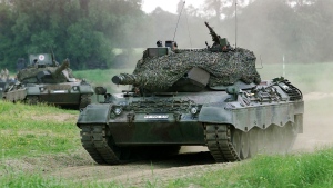 FILE - A Leopard 1 tank drives in Storkau, Germany, on May 19, 2000. (AP Photo/Eckehard Schulz, File) 