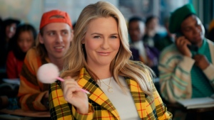 This photo provided by Rakuten Rewards shows Alicia Silverstone in a scene from Rakuten Rewards 2023 Super Bowl NFL football spot. Big name advertisers are paying as much as $7 million for a 30-second spot during the big game on Sunday, Feb. 12, 2023. In order to get as much as a return on investment for those million, most advertisers release their ads in the days ahead of the big game to get the most publicity for their spots. (Rakuten Rewards via AP) 
